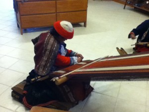 Weaver demonstrating at the CTTC store and museum in Cusco.