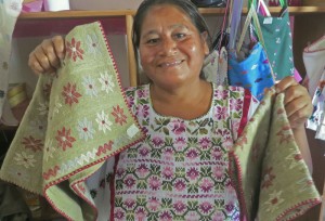 Maximama proudly displays her wares--the organic green cotton pillows. 
