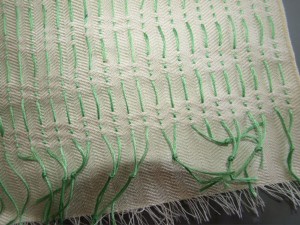 Knotted pattern threads (in green.)